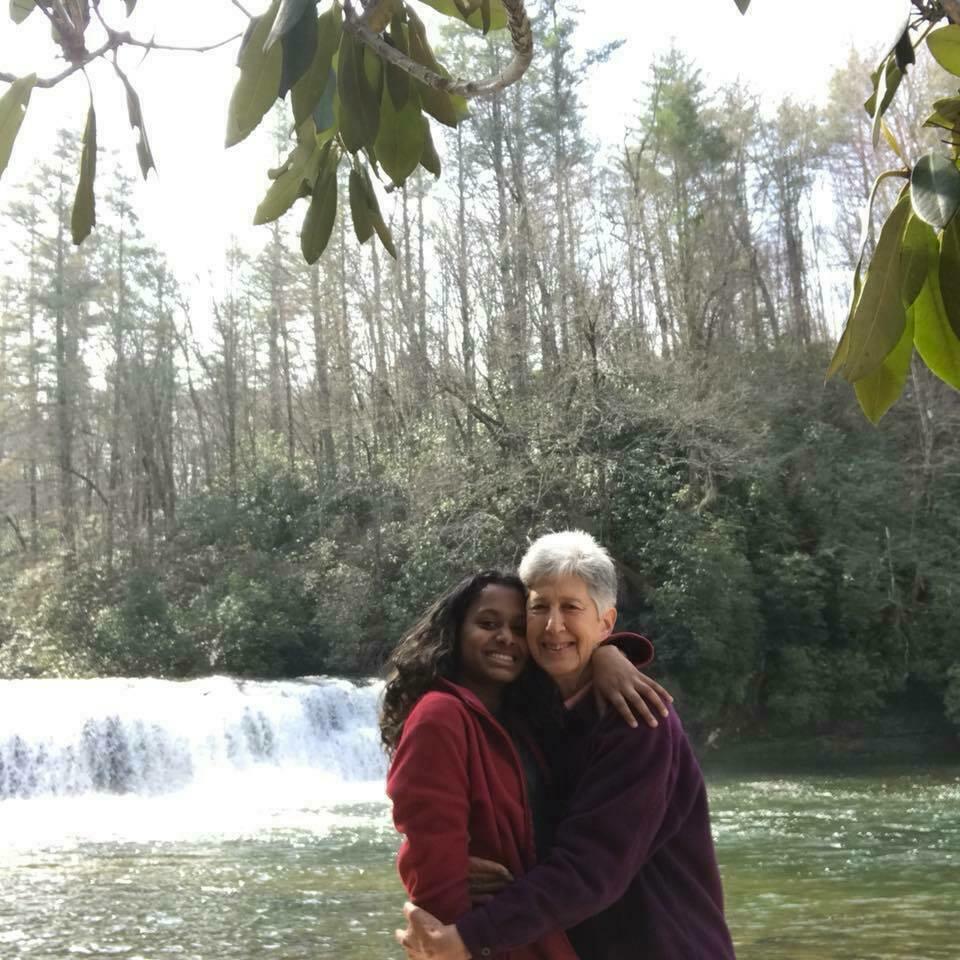 Jyoti and Elana by waterfall